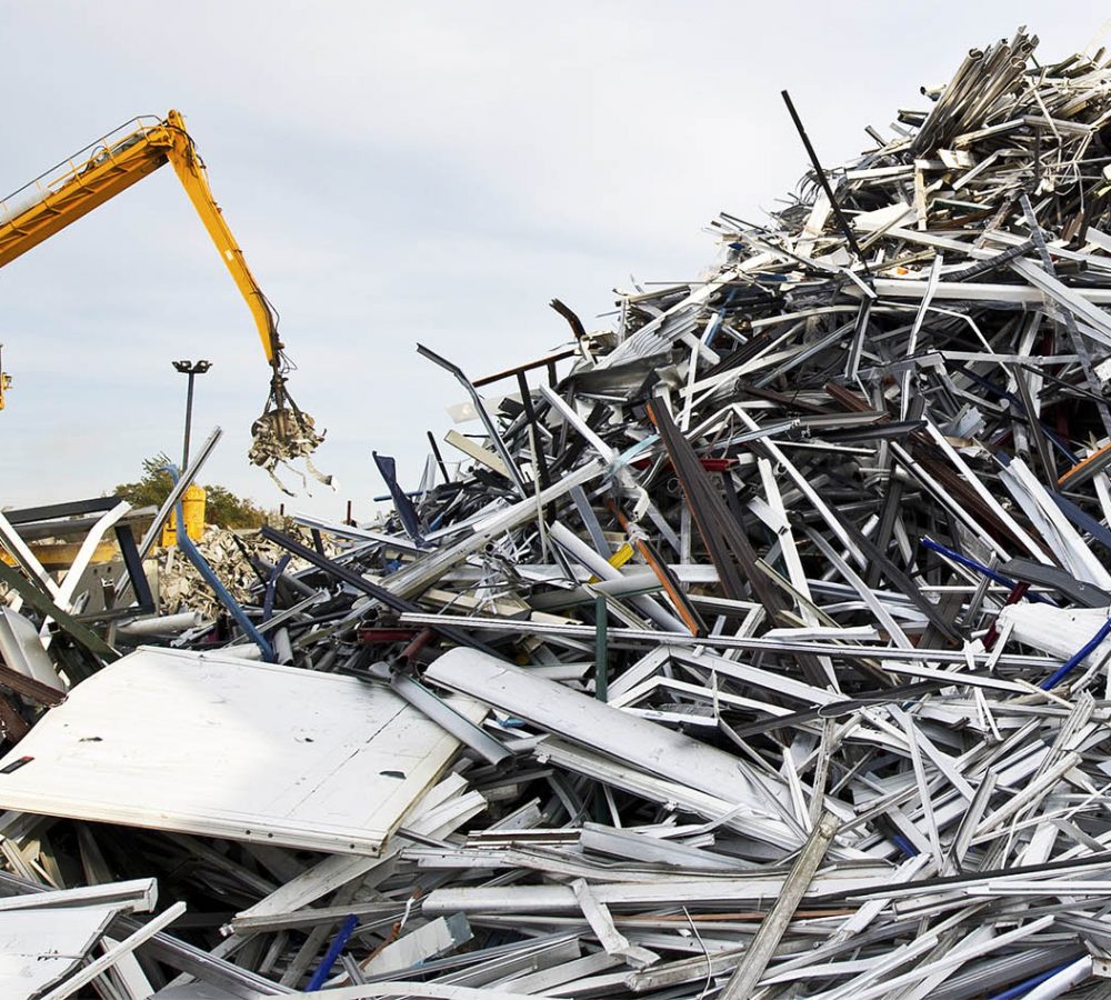 Scrap metal recycling plant and crane-Loading scrap in a truck